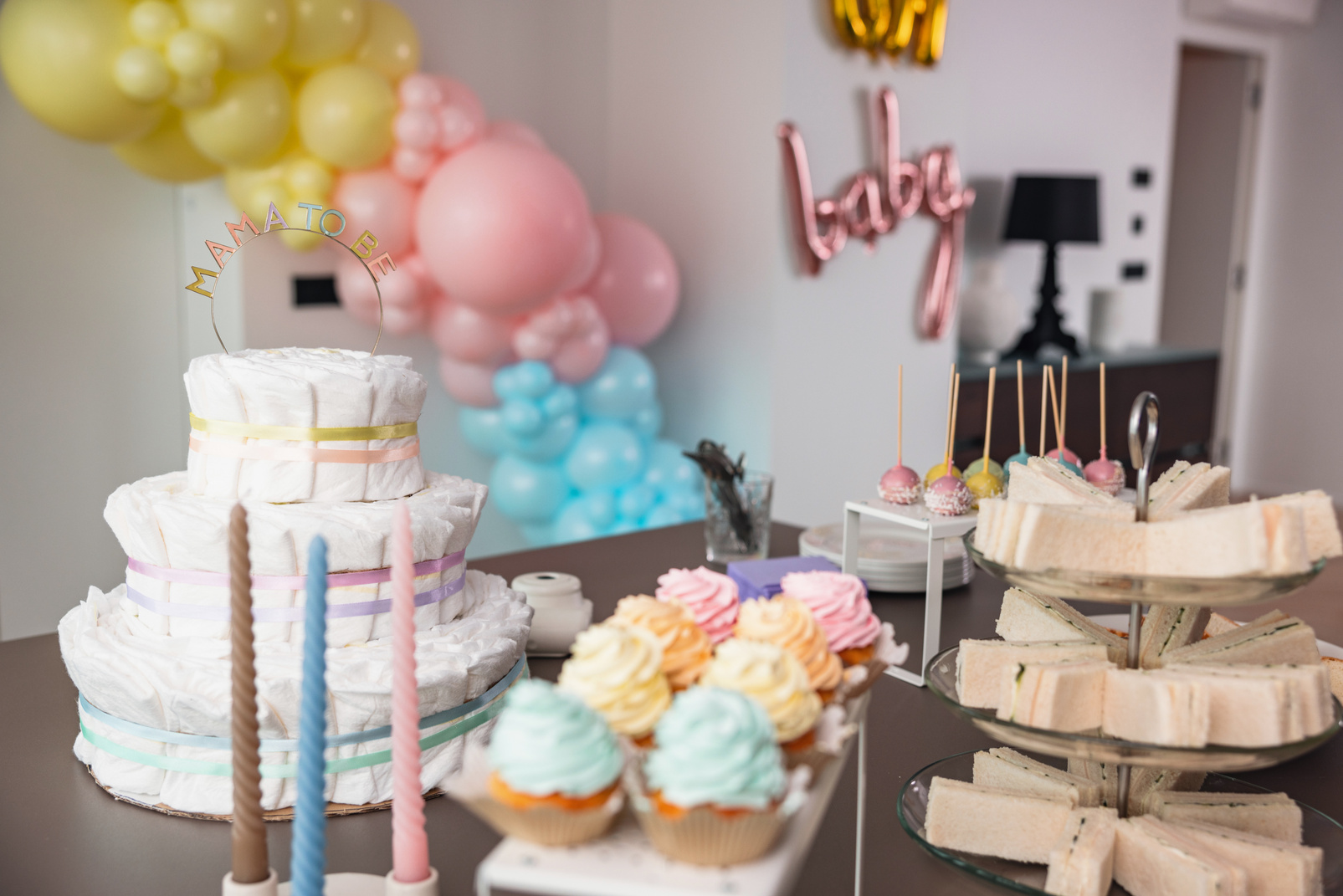 Decorated Table With Sweets And Snacks For A Baby Shower Celebration